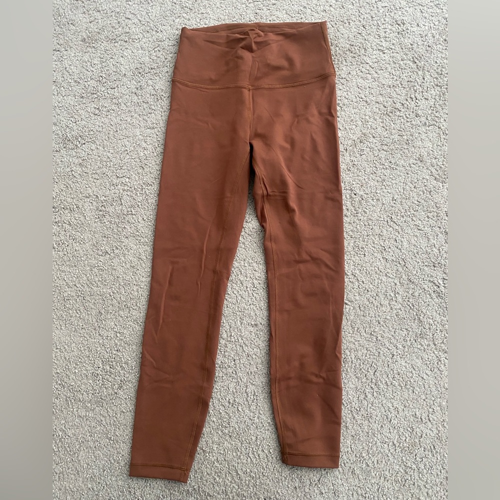 Wunder train high rise leggings, color is Java